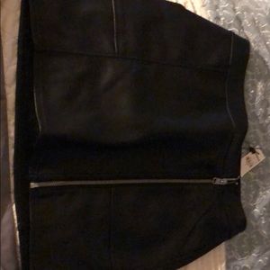 A black zip ups leather skirt